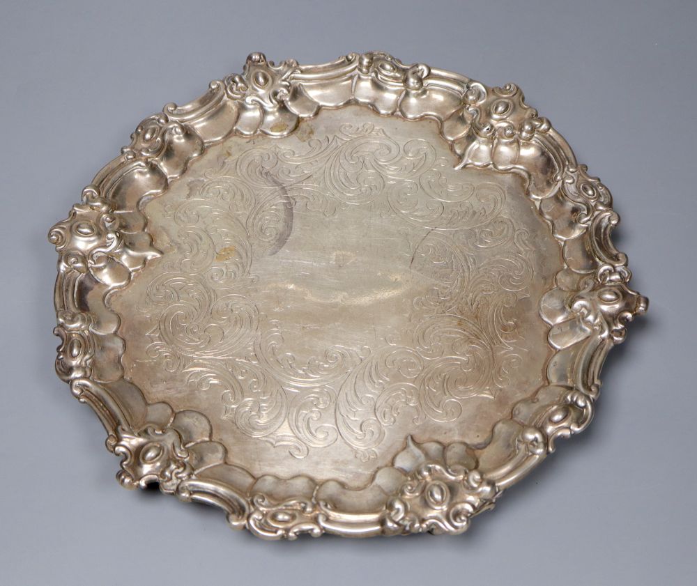 A Victorian embossed silver milk jug, Sheffield, 1860 and a silver salver, London, 1857, 27.5cm, 26oz.